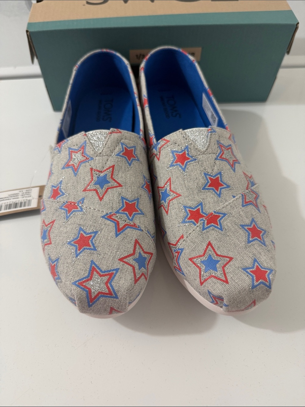 Toms Silver Slip-On Sneakers with Red & Blue Star Print